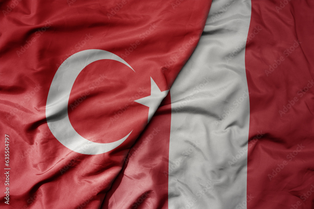 big waving national colorful flag of turkey and national flag of peru .