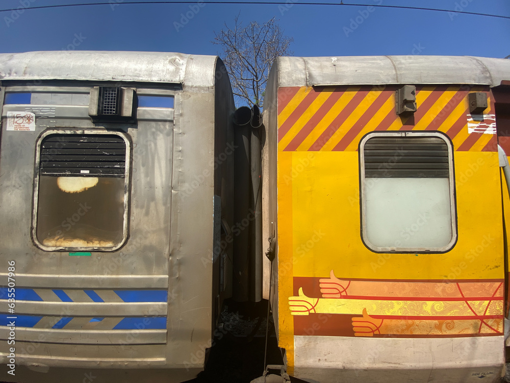 Mangalore, India - January 20 2023: A Colorful modern coaches coupled together of an Indian Railways train with glass windows