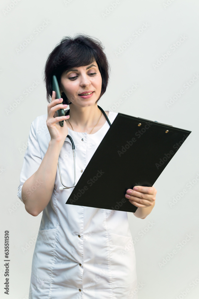 Nurse on the phone explaining the results of medical analysis. Nurse on the phone explaining the results of medical analysis.