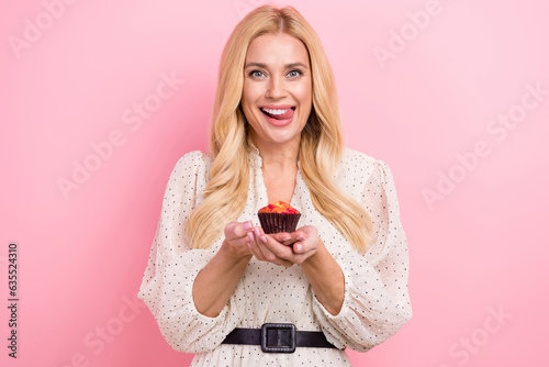 Canvas Print Photo portrait of lovely blonde woman hold cupcake lick teeth excited want dress