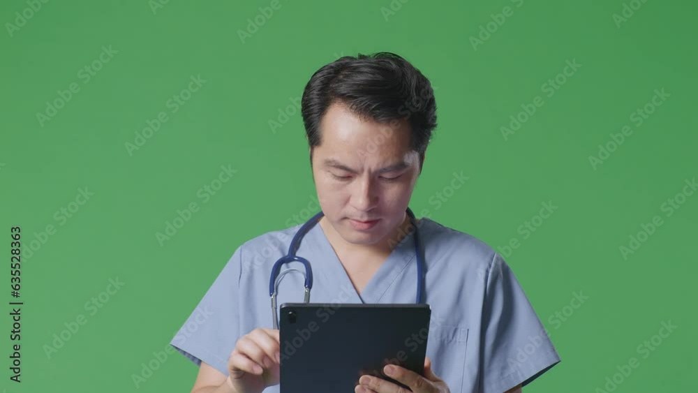 Close Up Of Asian Male Doctor With Stethoscope Using A Tablet While Walking On Green Screen Background In The Hospital
Close Up Of Asian Male Doctor With Stethoscope Using A Tablet While Walking On Green Screen Background In The Hospital