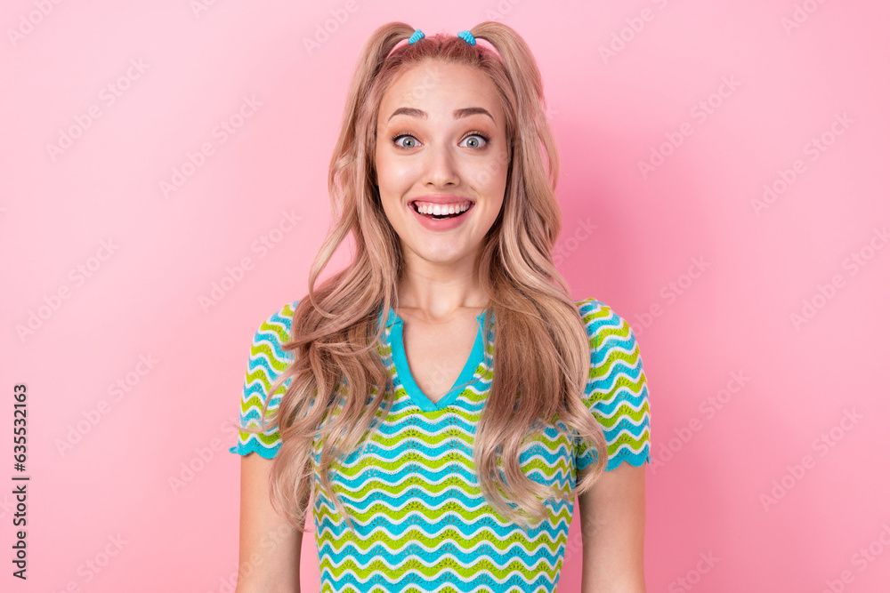 Photo of cheerful glad nice girl beaming smile curly hairdo dressed striped outfit good mood isolated on pink color background Photo of cheerful glad nice girl beaming smile curly hairdo dressed striped outfit good mood isolated on pink color background