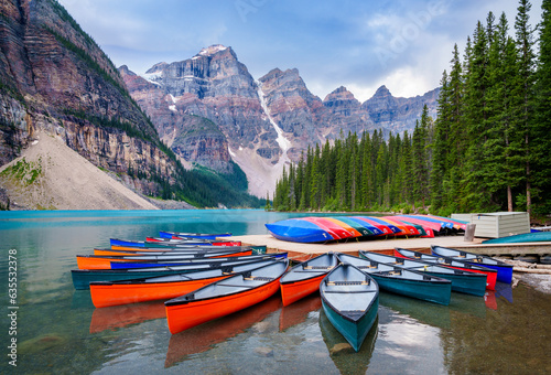 Colorful Canoes, Moraine Lake during summer in .Banff National Park, Canadian Rockies, Alberta, Canada...Banff National Park, Alberta, Canada
