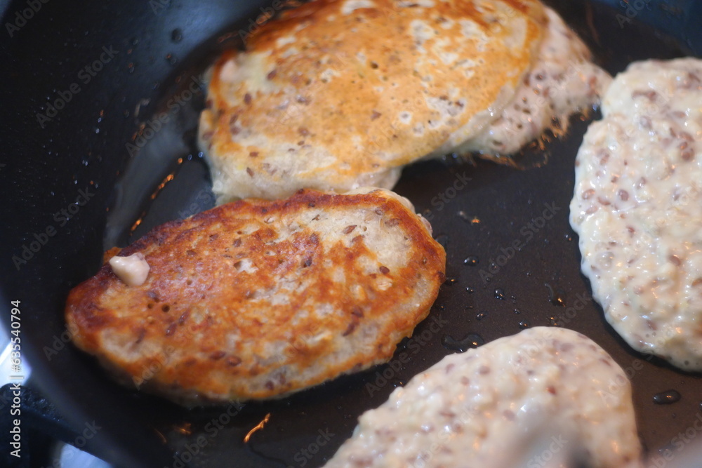 pancakes in a pan. Frying Pan On The Stove. Pancake Burned On The Pan. Mans Hand Turns The Pancake To The Other Side. He Lingers When He Sees That The Pancake Has Burned. pancakes in a pan. Frying Pan On The Stove. Pancake Burned On The Pan. Mans Hand Turns The Pancake To The Other Side. He Lingers When He Sees That The Pancake Has Burned.