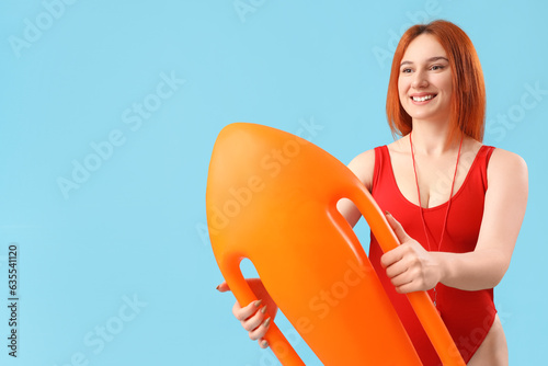 Female lifeguard with rescu...