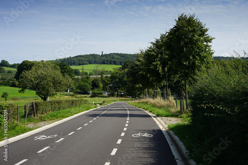 Dutch regional road with very well marked bicycle lanes. Located in the Dutch province Limburg near Vaals and Holset with the 