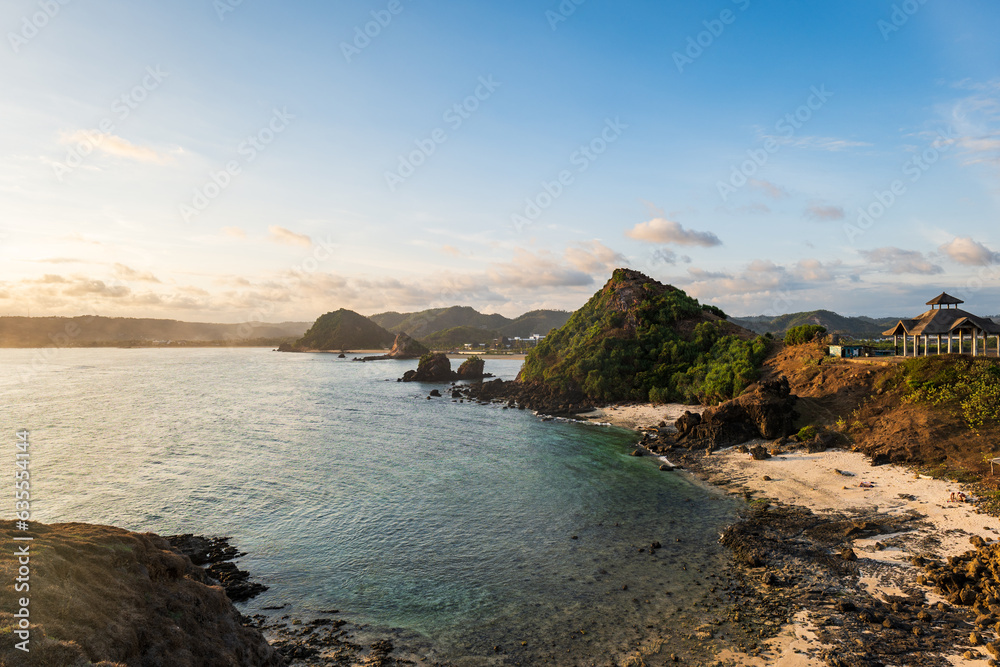 Lombok, Indonesia, Beach ocean sunset drone aerial view landscape at Seger beach area. Lombok is an island in West Nusa Tenggara province, Indonesia.