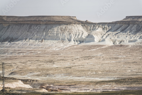 Panorama of hills and ridges with limestone and chalk slopes in the Kazakh steppe, relief folds in the desert tract of Boszhira photo