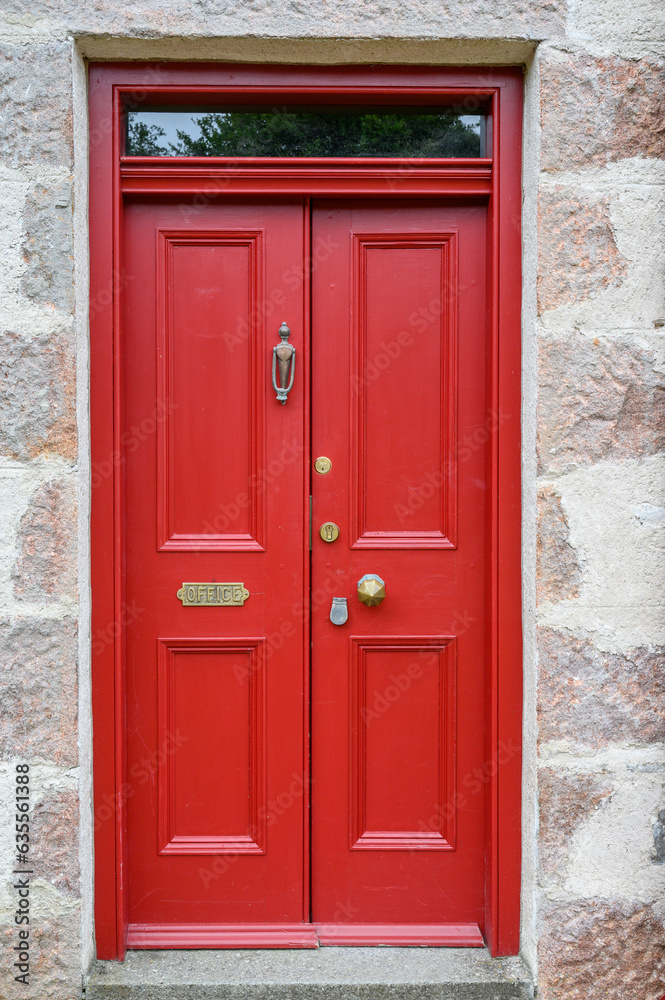 Red door on a Scottish cottage, Moray, Scotland. 
