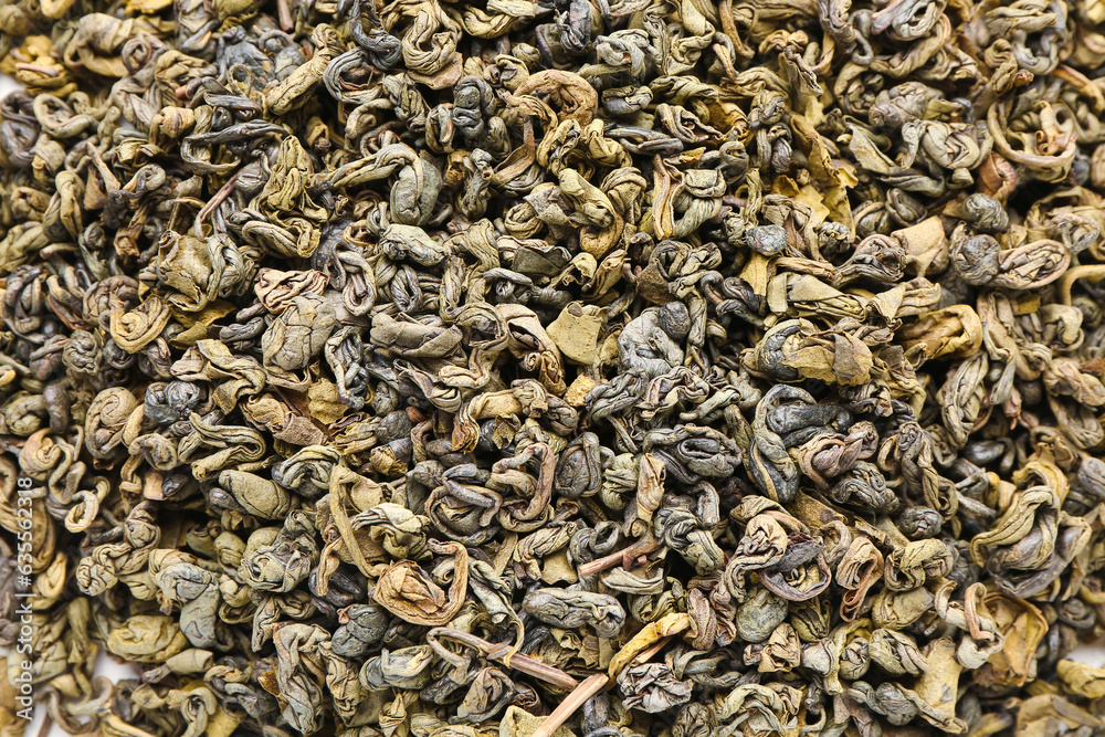 Dry green tea leaves as background, closeup Dry green tea leaves as background, closeup