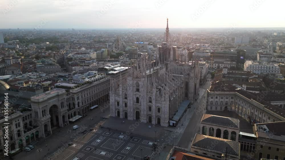 Europe, Italy, Milan - Aerial view of Piazza Duomo, gothic Cathedral in downtown center city. Drone aerial view of the gallery and rooftops during sunrise - Duomo Unesco Heritage sightseeing Europe, Italy, Milan - Aerial view of Piazza Duomo, gothic Cathedral in downtown center city. Drone aerial view of the gallery and rooftops during sunrise - Duomo Unesco Heritage sightseeing
