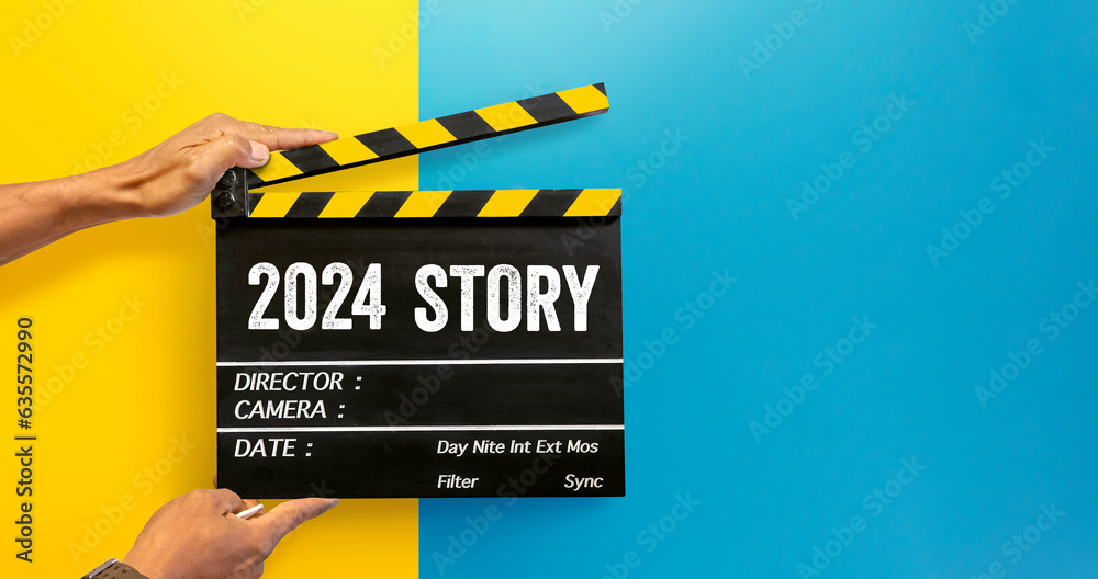 A new story begins in year 2024.Film industry worker holding film slate to tell a story