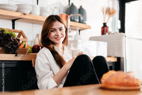 Activity at home leisure lifestyle concept, Young woman in clothes casual sitting in kitchen room to