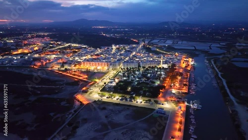 Sunset in Fuseta from an aerial drone view. Olhão Municipality. Lighthouse district. Marshes and salt flats of the Ria Formosa Natural Park. Atlantic Ocean. Algarve. Portugal. Europe