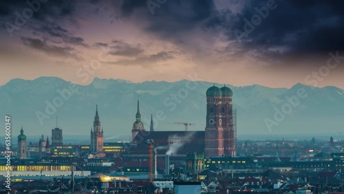 Munich city skyline aerial view time lapse footage from day to night, munich church frauenkirche in bachround pre alps mountins germany. photo