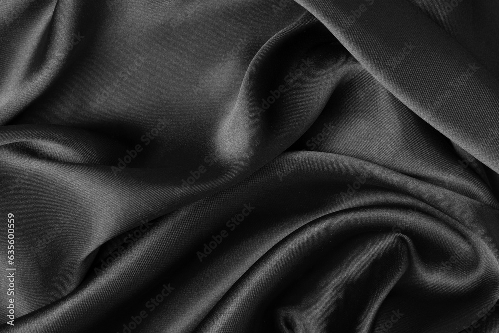 Black fabric texture background, wavy fabric slippery black color, luxury satin cloth texture. Black fabric texture background, wavy fabric slippery black color, luxury satin cloth texture.
