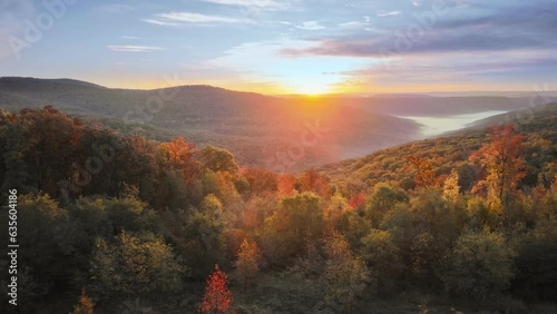 Beautiful Arkansas ozark mountain scenic overlook in fall with autumn colored forest via aerial viewpoint at sunrise