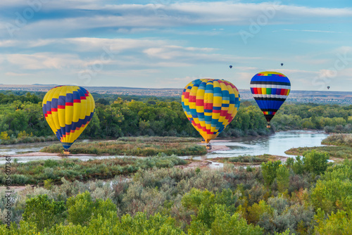 Hot Air Balloons flying over the Rio Grande near Albuquerque, New Mexico.