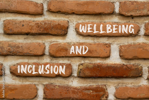 Inclusion and wellbeing symbol. Concept words Inclusion and wellbeing on beautiful brown brick. Beautiful red brown brickwall background. Motivational inclusion and wellbeing concept. Copy space.