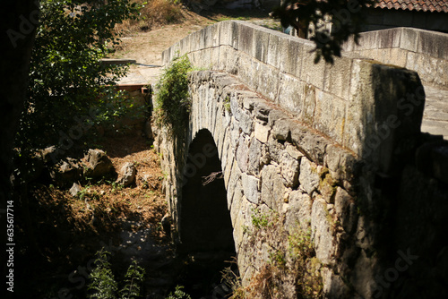 Harmonia entre a natureza e a história: a majestosa Ponte de Esmoriz sobre o Rio Ovil, uma joia arquitetônica na Rota do Românico. photo