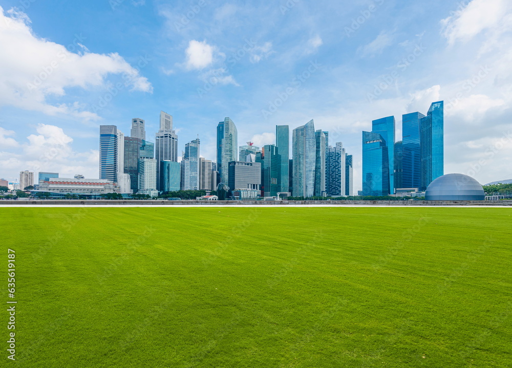 city skyline in the morning with green grass