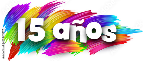 15 years at spanish paper word sign with colorful spectrum paint brush strokes over white. Vector illustration.