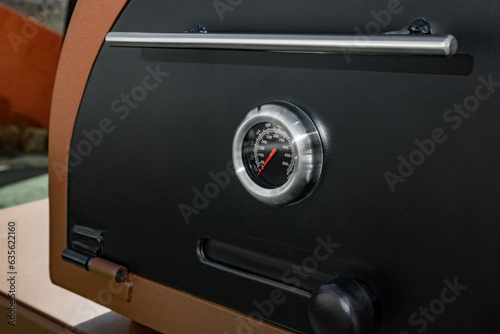 Close-Up of Thermometer on BBQ Grill Door