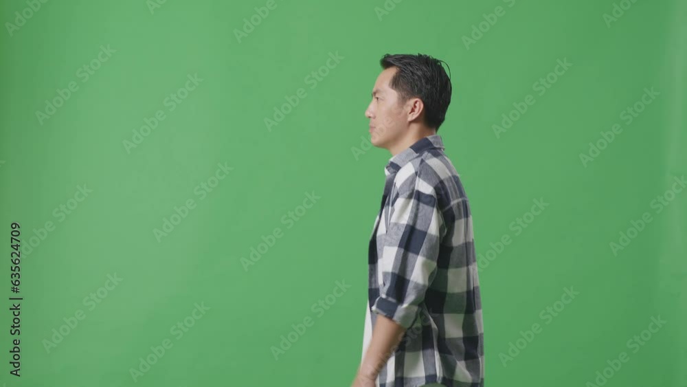 Side View Of Asian Man Walking In Green Screen Background
Side View Of Asian Man Walking In Green Screen Background