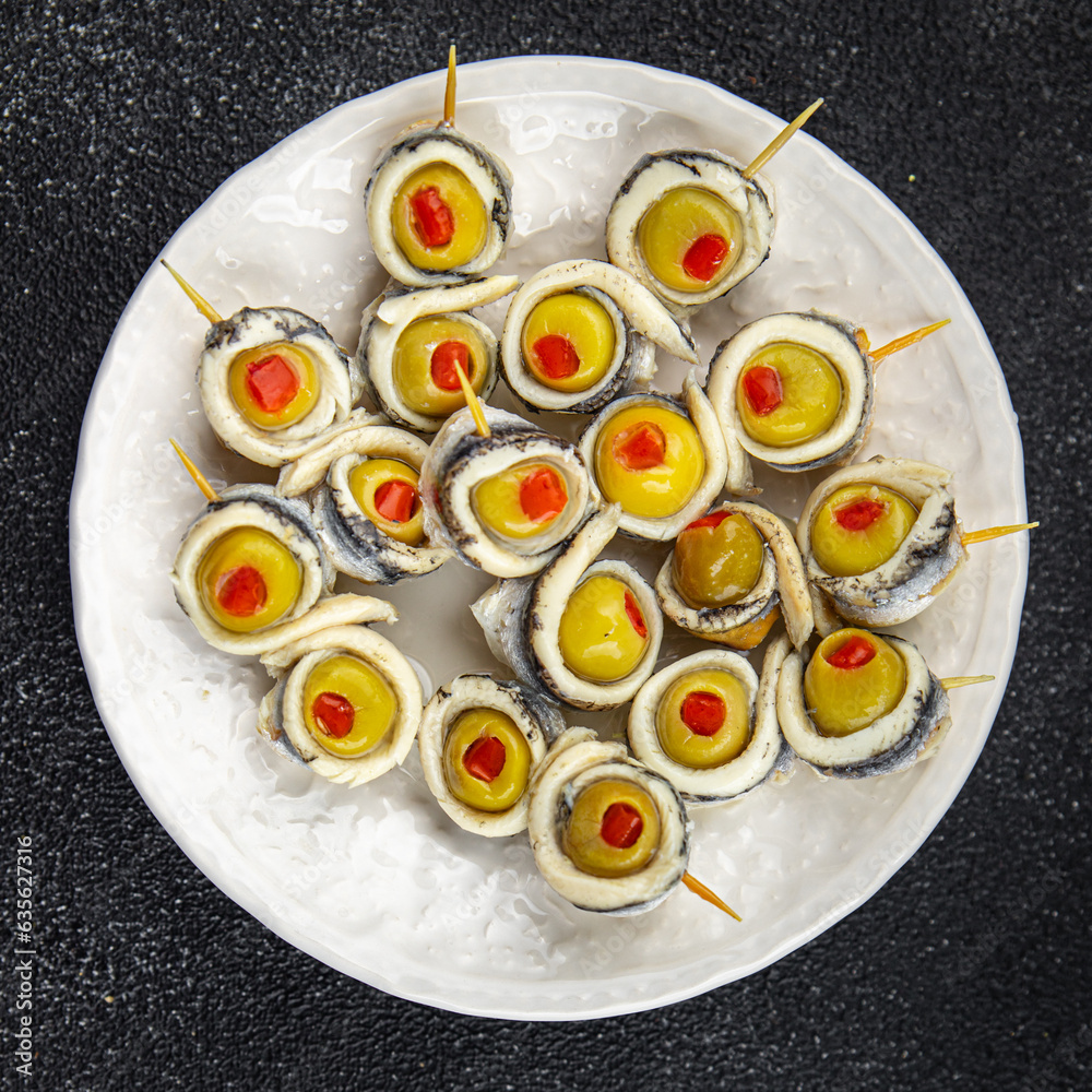olives stuffed with anchovy fillets, anchovy rolls stuffed olives apetizing seafood pickled fish