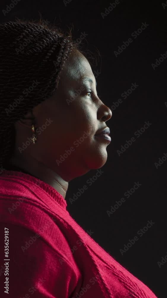 vertical video Side-view portrait of innovative black woman touching and scrolling for information on touchscreen. Female african american beauty in isolated background using AI screen. vertical video Side-view portrait of innovative black woman touching and scrolling for information on touchscreen. Female african american beauty in isolated background using AI screen.