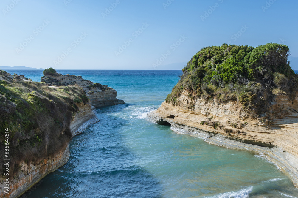 Afionas, Greece - June 19, 2021: Beach over Channel of Love in Sidari village