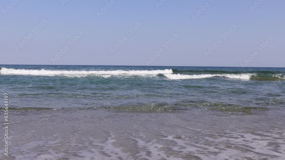 a white waves in the blue sea on the beach a white waves in the blue sea on the beach