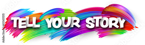 Tell your story paper word sign with colorful spectrum paint brush strokes over white. Vector illustration.