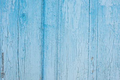 light blue cracked sun-bleached wooden background.