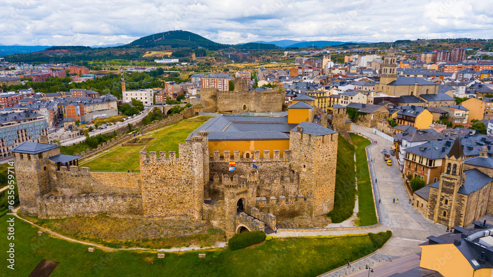 Aerial view of ancient Templar castle in small Spanish city of Ponferrada on background of modern cityscape