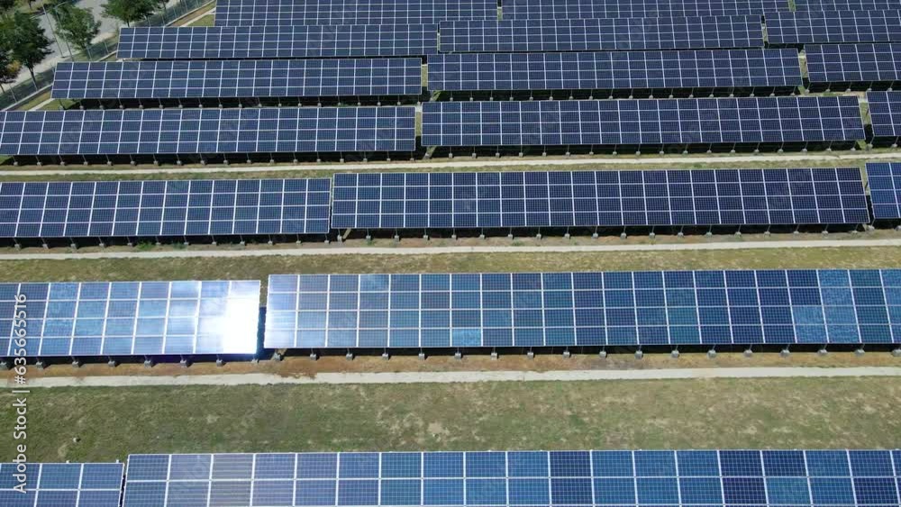 Rows of solar panels with reflections of the sun. Electrical energy. Renewable energy sources Rows of solar panels with reflections of the sun. Electrical energy. Renewable energy sources