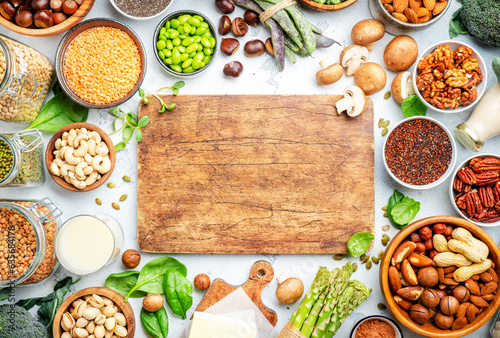 Vegan protein. Plant based vegetarian food sources. Healthy eating, diet ingredients: legumes, beans, lentils, nuts, soy and almond milk, tofu, cereals, vegetables, seeds and sprouts. Top view.