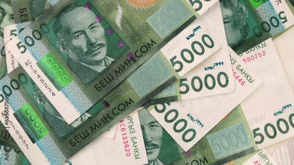 Paper 5000 som cash money background. Many five thousand of Kyrgyz som on table rotating closeup. Free currency exchange market. Issuing the salary. Paper 5000 som cash money background. Many five thousand of Kyrgyz som on table rotating closeup. Free currency exchange market. Issuing the salary.