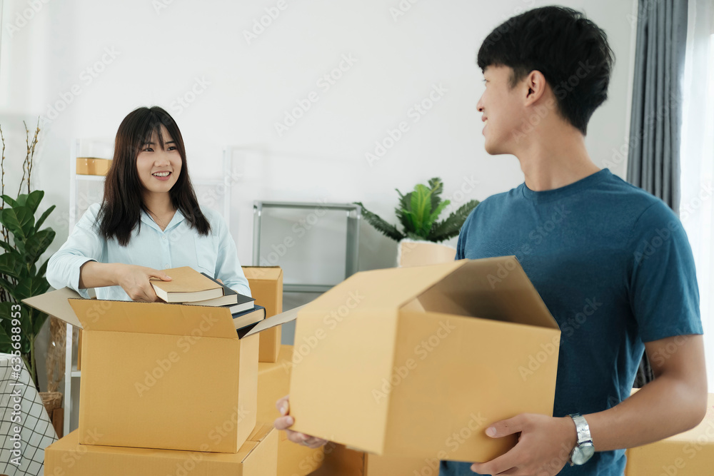 Happy young couple with cardboard boxes in their new home. Happy young couple with cardboard boxes in their new home.