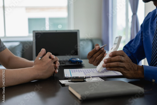 Signing a car insurance document or a rental agreement or agreement. Buy or sell a new or used car with car keys on the table in the office. close up pictures