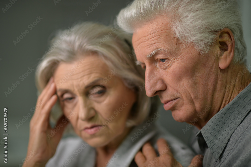 Close up portrait of sad senior couple posing at home Close up portrait of sad senior couple posing at home