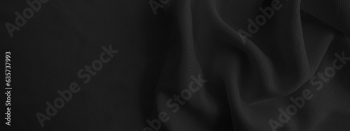 Abstract black wavy cloth. Dark fabric background.