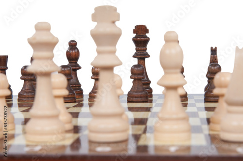 Wooden chess board and white and brown pawns