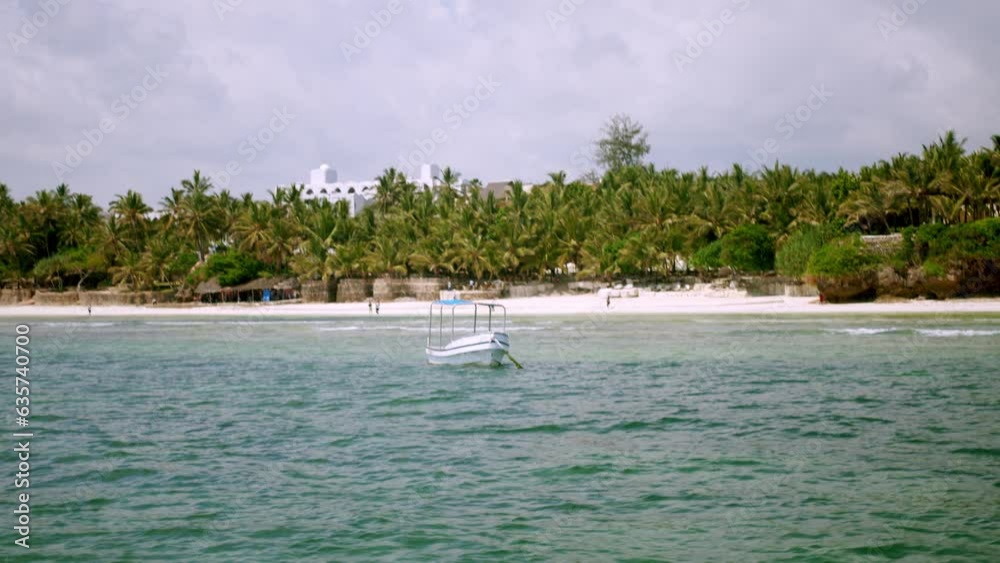 Boat Floating Over Tropical Coastline Of Diani Beach In Mombasa, Kenya Africa. Aerial Drone Shot Boat Floating Over Tropical Coastline Of Diani Beach In Mombasa, Kenya Africa. Aerial Drone Shot
