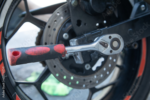  Wrench near the motorcycle vehicle. Maintenance, repair motorcycle