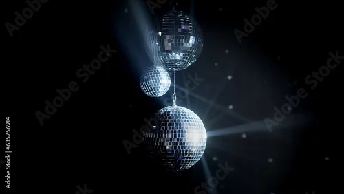 Obraz A colorful disco mirror ball illuminates the backdrop of a nightclub. The party lights up the disco ball.