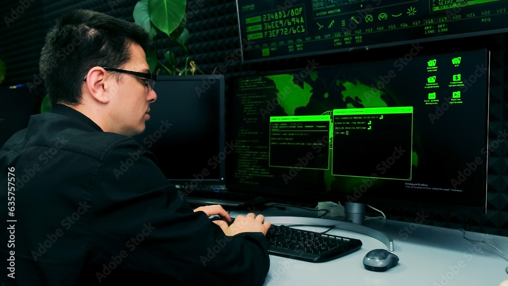 Side view of a stock market trader working at a computer with multiple monitors showing stock ticker numbers and charts