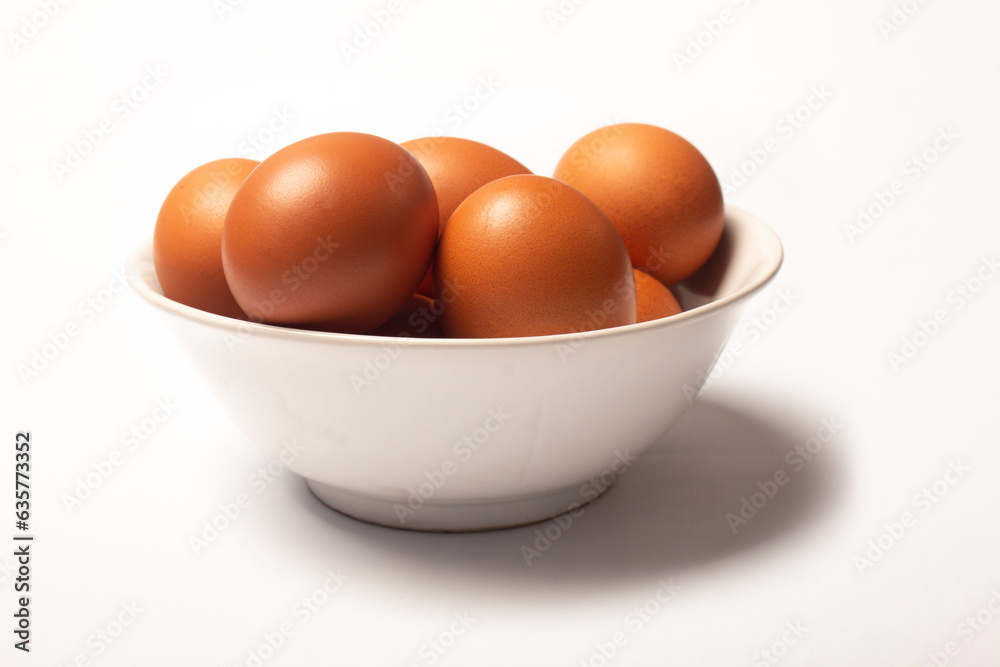 Photo of eggs in bowl isolated on white background Photo of eggs in bowl isolated on white background