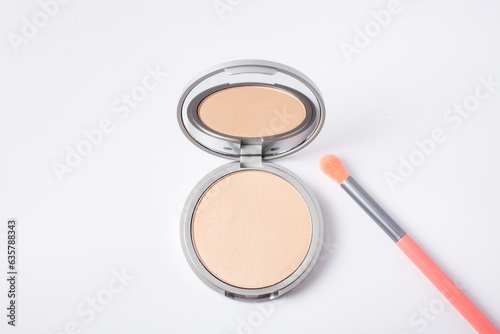 Beautiful eyeshadow palette with makeup brush lie on the table top view. Makeup product