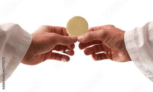 Hands of a priest consecrating a host with isolated background photo